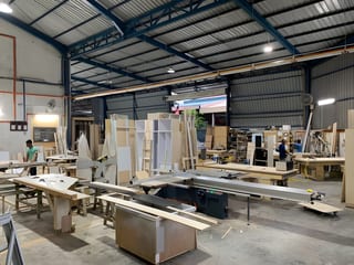 Cabinetry, workbenches and carpenters inside the workshop