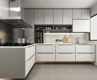 White kitchen cabinetry with warm lighting, plants and wooden boards beside the sink
